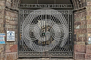 Huge Black metal gate at the main entrance with Lion head embossed on it on Gillander House
