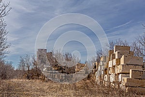 Huge blocks of cement and bare trees