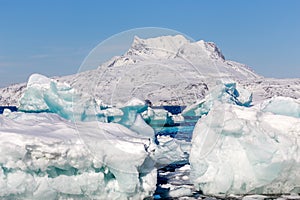 Huge blue icebergs drifting and laying ashore, Greenland