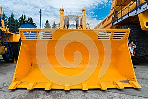 A huge bucket of a tractor loader-excavator