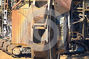 A huge bucket-wheel excavator digging coal on the open-pit mine.