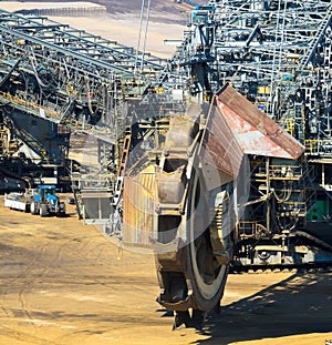 A huge bucket-wheel excavator digging coal on the open-pit mine.