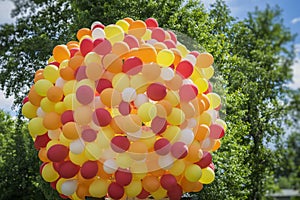 Huge bundle of balloons balloons in golden orange-red colors, party, birthday, celebration,. Festive concept