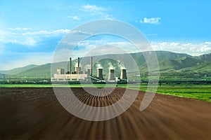 Huge chimneys of thermal power plant on a field