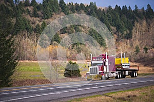 Huge classic american semi truck with over dimensional cargo