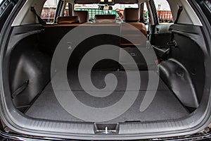 Huge, clean and empty car trunk in interior of compact suv.