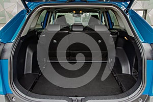 Huge, clean and empty car trunk in interior of compact suv.