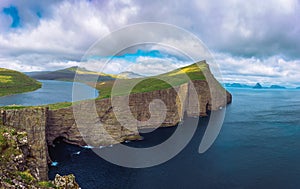 Huge cliff and lake Sorvagsvatn on island of Vagar, Faroe Islands, Denmark.