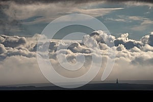 Huge clouds billow upwards behind Studley Pike