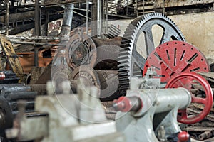 Huge cog wheel in industrial hall