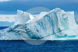 Huge colorful Iceberg with escarpment, Greenland