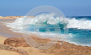 Huge Colorful Wave Breaks on a Beach in Mexico