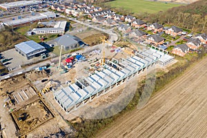 Huge company building is erected on a large construction site