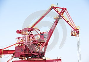 Huge construction crane against clear blue sky