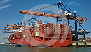 Huge container ship in Rotterdam harbour