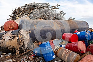 Huge containers and drums in a junkyard