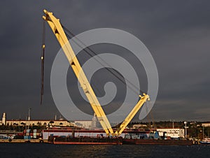 A huge yellow  crane on port photo