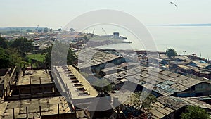 Huge crowed gathered for holy bathing at ganges river edge from top angle