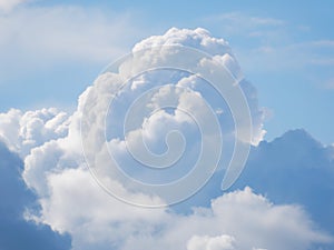 A huge cumulus cloud on a blue sky.