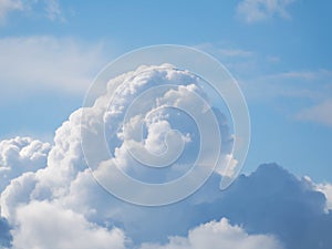 A huge cumulus cloud on a blue sky.