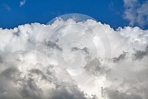 Huge Cumulus cloud and clear blue sky