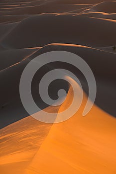 Huge desert dunes of Erg Chigaga, at the gates of the Sahara, al amanecer. Morocco. Concept of travel and adventure