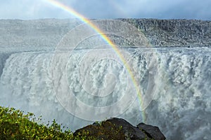 Huge Dettifoss waterfall with a double rainbow, Iceland