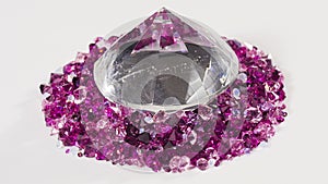 Huge diamond with many small gems stones rotating over white, loop ready