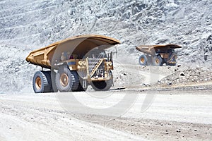 Huge dump trucks in an open pit Copper mine