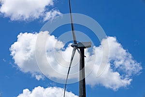 A huge electricity generator with wind with its three blades