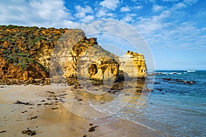 Huge eroding rocks on ocean coastline.