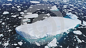 Huge floating iceberg aerial tracking