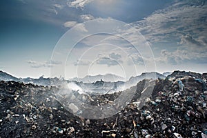 Huge garbage dump landscape full of litter, plastic bottles and other trash at the Thilafushi island