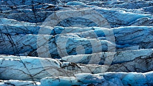 Huge glacier with pure blue ice at sunny weather. Vatnajokull glacier covered snow in Iceland. Beautiful nature abstract