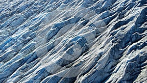 Huge glacier with pure blue ice at sunny weather. Vatnajokull glacier covered snow in Iceland. Beautiful nature abstract