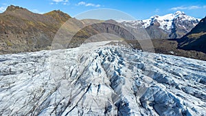 Huge glacier with pure blue ice at sunny weather. Vatnajokull glacier in Iceland. Beautiful nature abstract background