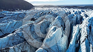 Huge glacier with pure blue ice at sunny weather. Vatnajokull glacier in Iceland. Beautiful nature abstract background