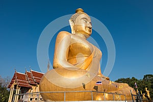 The huge golden Buddha at khao kiaw temple in ratchaburi Thailand.