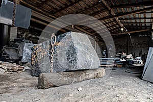 Huge granite stone in a stone processing factory. Stone cutting