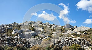 Huge granite volcanic rock, Volax village in Tinos island, Cyclades Greece. Sunny day, blue sky