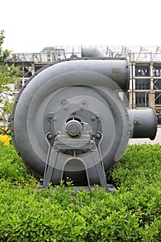 Huge gray mechanical equipment in an industrial park