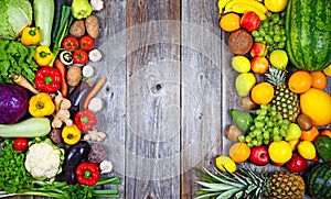 Huge group of fresh vegetables and fruit on wooden background - Vegetables VS Fruit - High quality studio shot