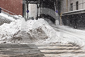 Huge heap of dirty snow and ice on a city street