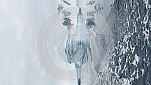 A huge high breakaway glacier is passing by in the southern ocean off the coast of Antarctica, the Antarctic Peninsula