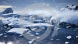 Huge high glaciers in winter natural conditions, the sea in ice, snow and blizzards. Arctic winter snowy landscape. 3D