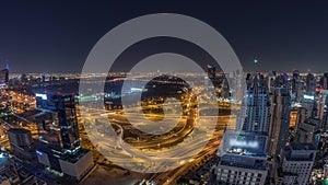 Huge highway crossroad junction between JLT district and Dubai Marina all night timelapse.