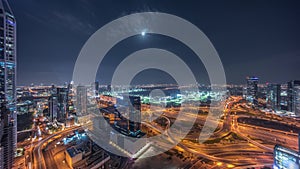 Huge highway crossroad junction between JLT district and Dubai Marina night timelapse.