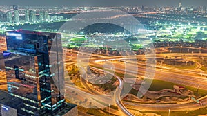 Huge highway crossroad junction between JLT district and Dubai Marina night timelapse.