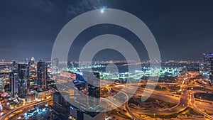 Huge highway crossroad junction between JLT district and Dubai Marina night timelapse.