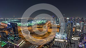 Huge highway crossroad junction between JLT district and Dubai Marina night timelapse.